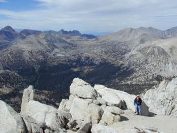 Pat Rowley on Mono Rock peak with Mono Creek in the background