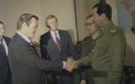 Donald Henry Rumsfeld greets Saddam Hussein